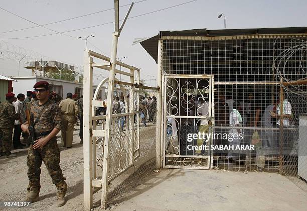 An Iraqi soldier stands guard at Al-Rusafa detention facility in Baghdad before the release on April 29, 2010 of about 120 prisoners, according to...