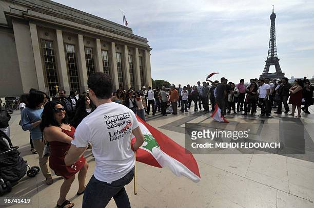Lebanese laique pride secular activists dance the Dabke - a popular Arabic folk dance - during a demonstration on April 25, 2010 in Paris to promote...