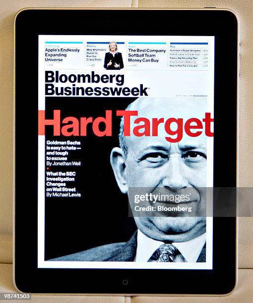 Apple Inc.'s iPad tablet computer displays a electronic copy of the Bloomberg Businessweek magazine during the American Express Publishing Luxury...
