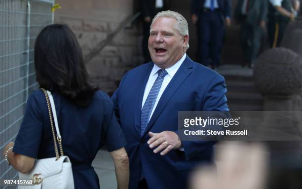 Doug Ford reacts after missing his entrance to Queens Park as he arrives. Doug Ford is sworn in as the 26th Premier of Ontario by The Honourable...