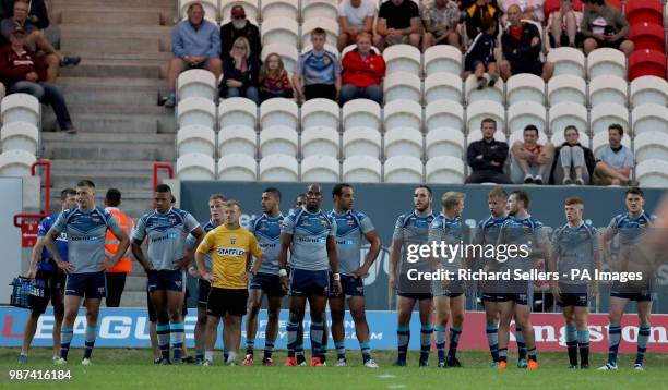 Huddersfield Giants players look dejected after conceding during the Betfred Super League match at Craven Park, Hull.