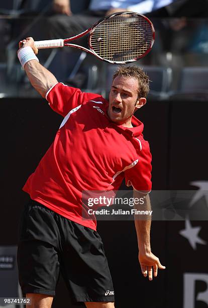 Filippo Volandri of Italy plays a backhand in his match against Ernests Gulbis of Latvia during day five of the ATP Masters Series - Rome at the Foro...