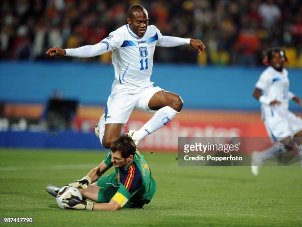 Iker Casillas of Spain saves at the feet of David Suazo of Honduras during a FIFA World Cup Group H match at Ellis Park on June 21, 2010 in...