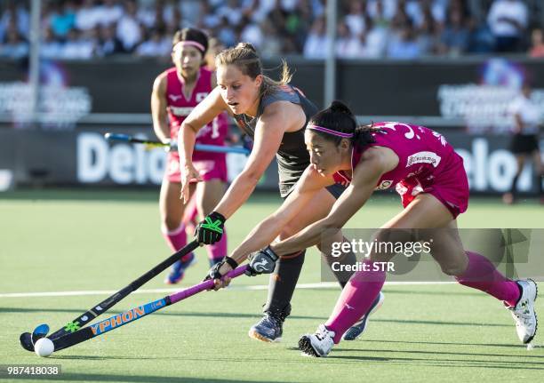 Kelly Jonker from The Netherlands vies with Hazuki Juda from Japan during the field hockey match between the Netherlands and Japan at the 4 Nations...