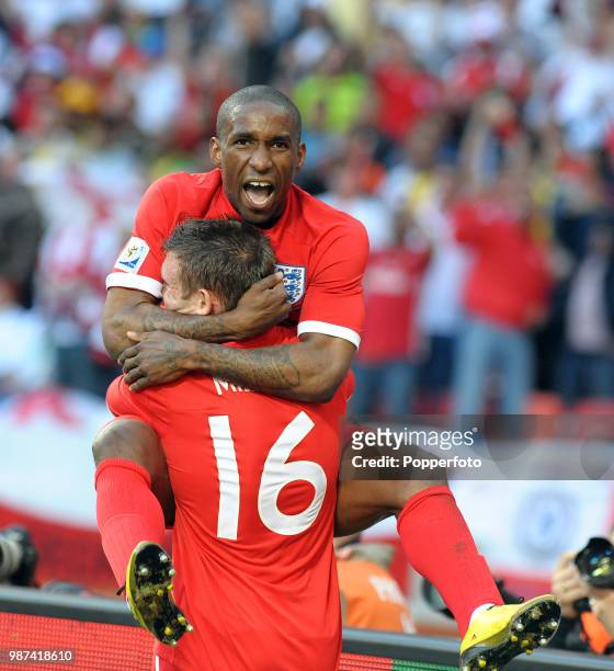 Jermain Defoe of England celebrates with teammate James Milner after scoring during the FIFA World Cup Group C match between Slovenia and England at...