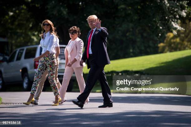 June 29: Left, Barron and First Lady Melania Trump, her mother, Amalija Knavs, and President Donald Trump make their way towards Marine One from the...