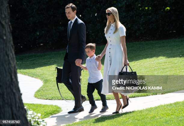 Ivanka Trump walks with her husband Jared Kushner and their son Theodore to board Marine One at the White House in Washington, DC, on June 29, 2018...