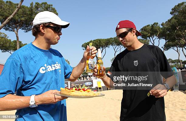Bob and Mike Bryan of USA receive a cake on their birthday after playing some beach tennis during day five of the ATP Masters Series - Rome at the...