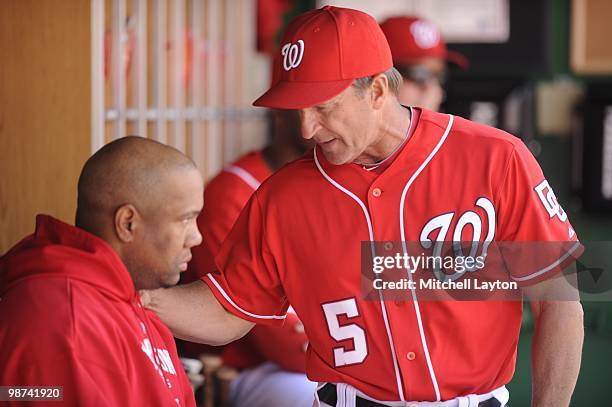 Washington Nationals manager Jim Riggleman speaks to Livan Hernandez during a baseball game against the Milwaukee Brewers on April17, 2010 at...