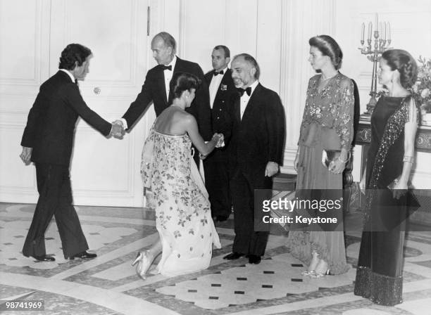 King Hussein of Jordan with his wife Queen Noor at a gala reception hosted by French President Valery Giscard d'Estaing at the Grand Trianon,...