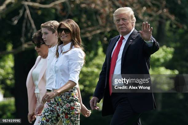 President Donald Trump , first lady Melania Trump , their son Barron Trump , and mother-in-law Amalija Knavs walk on the South Lawn of the White...