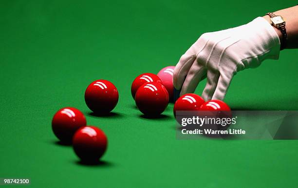 Referee Michaela Tabb keeps an eye on play as Ali Carter of England and Neil Robertson of Australia play the semi final match of the Betfred.com...