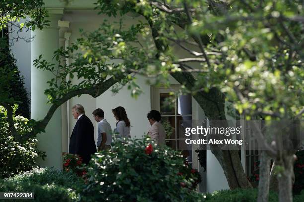 President Donald Trump, son Barron Trump, first lady Melania Trump and mother-in-law Amalija Knavs leave the Oval Office of the White House prior to...