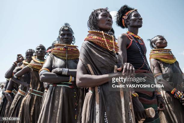 Turkana tribals pause before their performance during the 11th Marsabit Lake Turkana Culture Festival in Loiyangalani near Lake Turkana, northern...