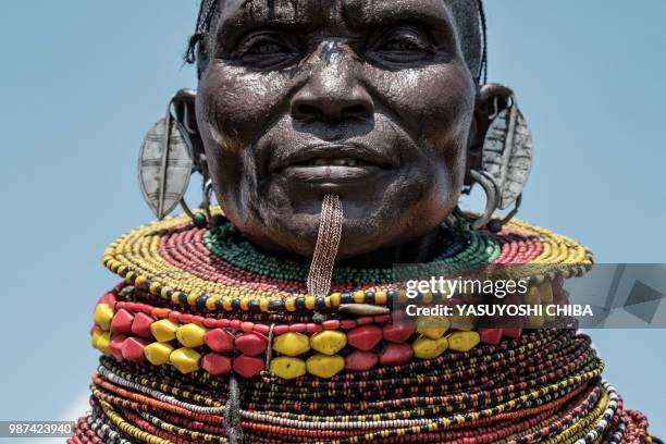 Woman of the Turkana tribe performs during the 11th Marsabit Lake Turkana Culture Festival in Loiyangalani near Lake Turkana, northern Kenya, on June...