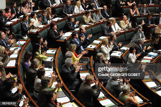 Members of the Belgian Parliament Lower House applaud at the start of a session, on 29 April 2010. Last Monday, the king accepted the resignation of...