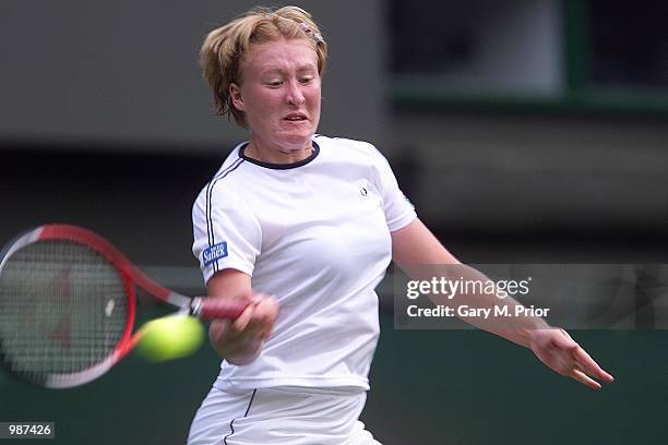 Elena Baltacha of Great Britain in action against Nathalie Dechy of France during the women's first round of The All England Lawn Tennis Championship...