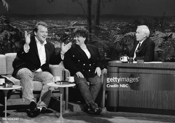 Pictured: Comedians Tom Arnold and Roseanne Barr during an interview with host Johnny Carson on July 20, 1990 --
