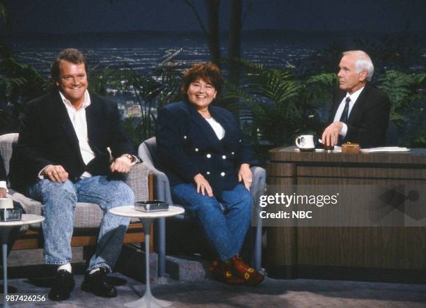 Pictured: Comedians Tom Arnold and Roseanne Barr during an interview with host Johnny Carson on July 20, 1990 --