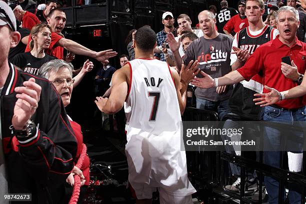 Brandon Roy of the Portland Trail Blazers high-fives fans as he exits the court in Game Four of the Western Conference Quarterfinals against the...