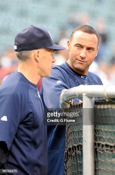 Derek Jeter of the New York Yankees talks to Manager Joe Girardi before the game against the Baltimore Orioles at Camden Yards on April 27, 2010 in...