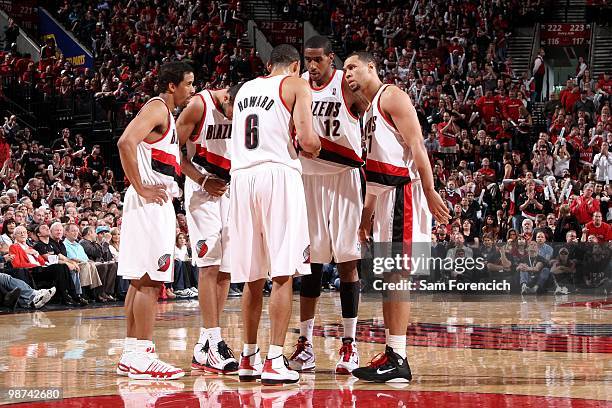 Andre Miller, Nicolas Batum, Juwan Howard, LaMarcus Aldridge and Brandon Roy of the Portland Trail Blazers huddle on the court in Game Four of the...