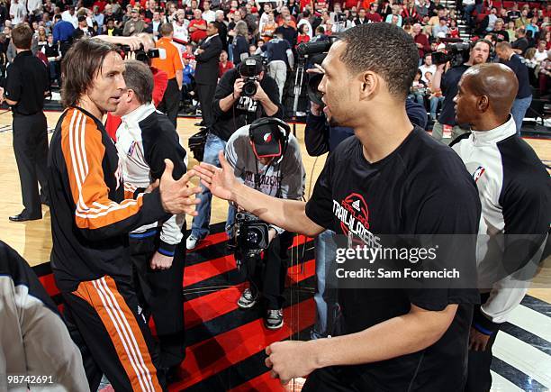 Steve Nash of the Phoenix Suns shakes hands with Brando Roy of the Portland Trail Blazers at center court prior to Game Four of the Western...