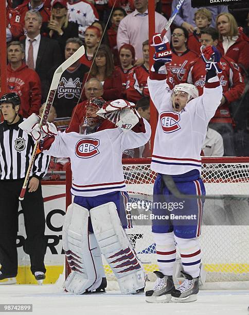 Goaltender Jaroslav Halak and Andrei Markov of the Montreal Canadiens celebrate following a 2-1 defeat against the Washington Capitals in Game Seven...