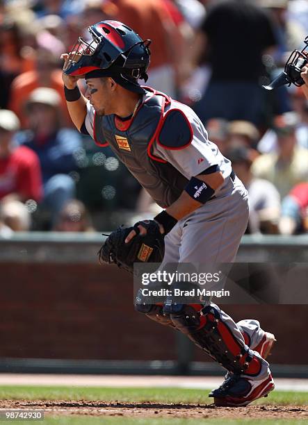 Yadier Molina of the St. Louis Cardinals chases a bunt during the game between the St. Louis Cardinals and the San Francisco Giants on Sunday, April...