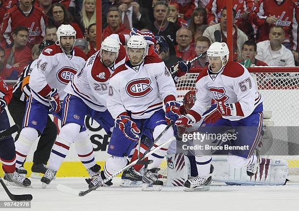 Roman Hamrlik, Ryan O'Byrne, Maxim Lapierre, Jaroslav Halak and Benoit Pouliot of the Montreal Canadiens defend the net against the Washington...