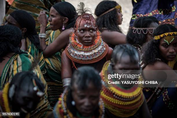 Woman of the Turkana tribe takes a rest in the shade among other tribesduring the 11th Marsabit Lake Turkana Culture Festival in Loiyangalani near...
