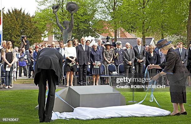 Dutch Queen Beatrix unveils on April 29, 2010 in Apeldoorn the monument of remebrance for the victims of the incident on Queensday last year,...