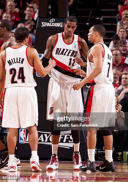 Andre Miller, LaMarcus Aldridge and Brandon Roy of the Portland Trail Blazers huddle on the court in Game Four of the Western Conference...