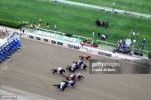 Justify, ridden by jockey Mike Smith start with the other horses on his way to winning the 150th running of the Belmont Stakes at Belmont Park on...