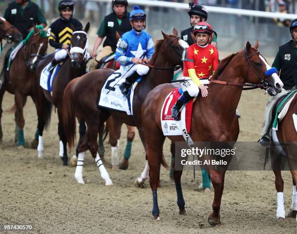 Jockey Mike Smith sits atop of Justify before the 150th running of the Belmont Stakes at Belmont Park on June 9, 2018 in Elmont, New York. Justify...