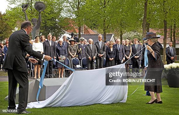 Dutch Queen Beatrix unveils on April 29, 2010 in Apeldoorn the monument of remebrance for the victims of the incident on Queensday last year,...