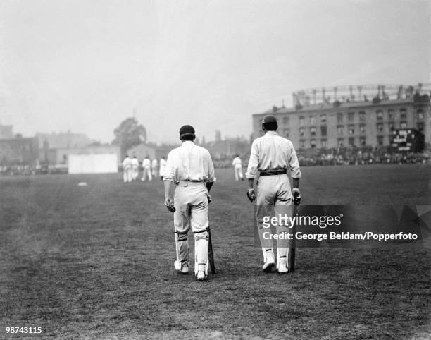England's opening batsmen AC MacLaren and LCH Palairet walk out to bat during the 5th Test match between England and Australia at the Oval, August...