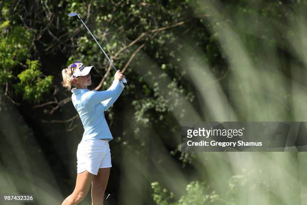 Jessica Korda watches her drive on the 17th hole during the second round of the 2018 KPMG PGA Championship at Kemper Lakes Golf Club on June 29, 2018...
