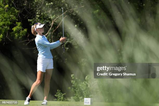 Jessica Korda watches her drive on the 17th hole during the second round of the 2018 KPMG PGA Championship at Kemper Lakes Golf Club on June 29, 2018...