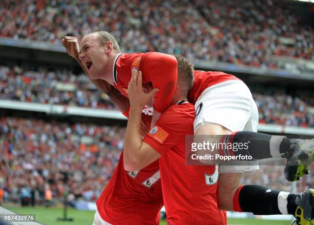 Wayne Rooney of Manchester United celebrates after Nani had scored their 3rd goal during the FA Community Shield match between Manchester City and...