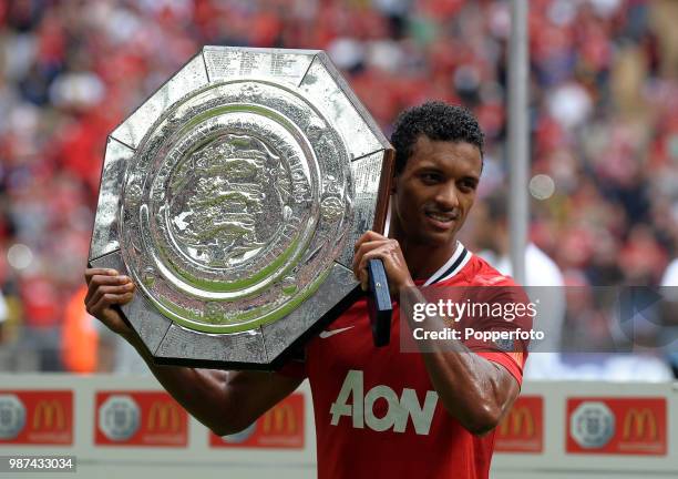 Man of the Match Nani of Manchester United celebrates with the trophy following the FA Community Shield match between Manchester City and Manchester...