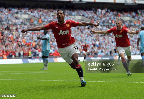 Nani of Manchester United celebrates with teammate Tom Cleverley after scoring United's second goal during the FA Community Shield match between...