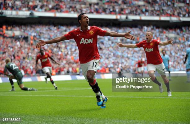 Nani of Manchester United celebrates with teammate Tom Cleverley after scoring United's second goal during the FA Community Shield match between...