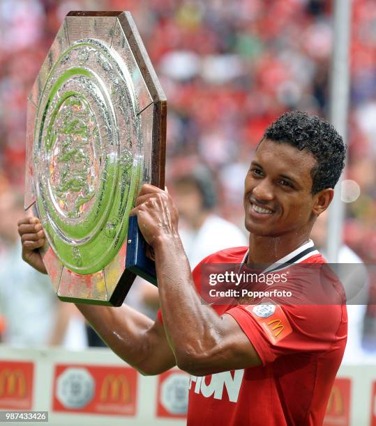 Man of the Match Nani of Manchester United celebrates with the trophy following the FA Community Shield match between Manchester City and Manchester...