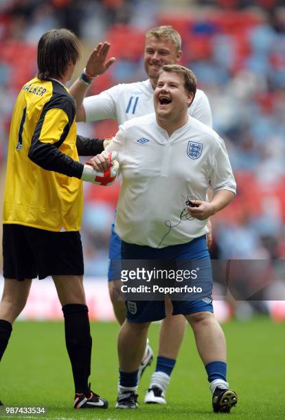 Presenter James Corden during the half-time entertainment of the FA Community Shield match between Manchester City and Manchester United at Wembley...
