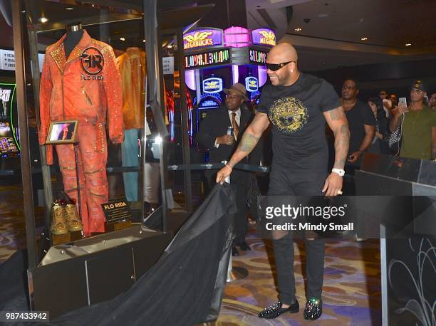 Rapper Flo Rida unveils his memorabilia case during the dedication at the Hard Rock Hotel & Casino on June 29, 2018 in Las Vegas, Nevada.