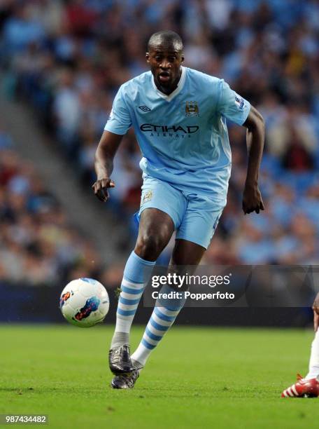 Yaya Toure of Manchester City in action during the Barclays Premier League match between Manchester City and Swansea City at Etihad Stadium in...