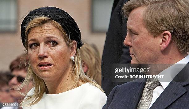 Dutch Princess Maxima cries next Dutch Prince Willem-Alexander as they attend on April 29, 2010 in Apeldoorn a ceremony at the monument of remebrance...
