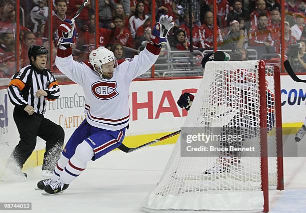 Dominic Moore of the Montreal Canadiens scores the game winning goal in the third period against the Washington Capitals in Game Seven of the Eastern...