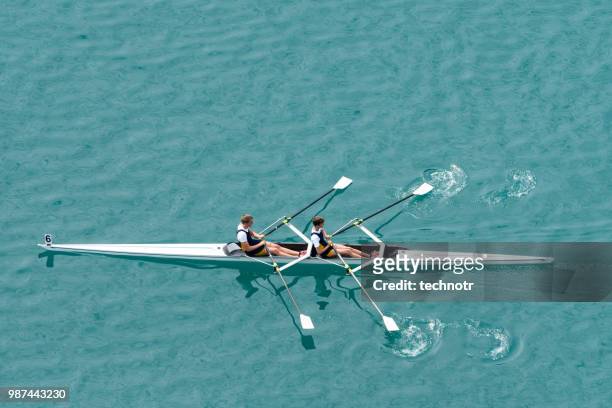 double scull rowing team practicing - coordinated effort stock pictures, royalty-free photos & images